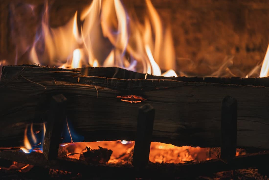 Chimney sweep cleaning a bungalow fireplace in the SoHo district of South Tampa